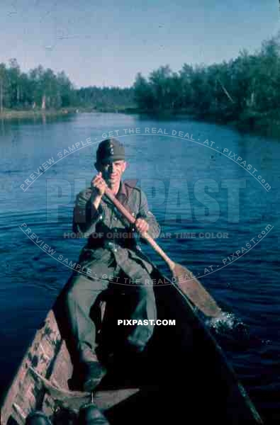 134th Gebirgsjaeger, Finland 1944, german soldier in boat on river.