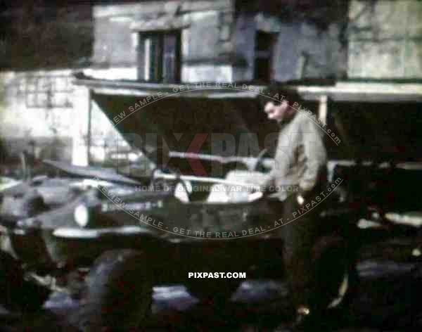 8mm home movie, France 1944, American GI soldier driving captured German Volkswagen Schwimmwagen Jeep