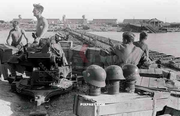 A Germany army anti-aircraft FLAK unit securing a make-shift pontoon bridge over the river Donau. Kalach-na-Donu 1942