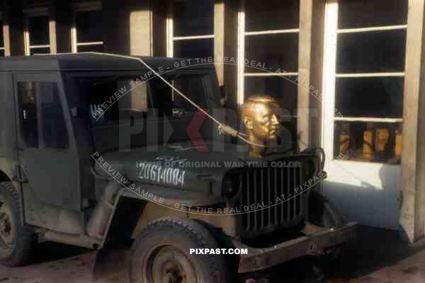 Adolf Hitler statue head bolted to front of American Willi Jeep as   war trophy, Heidelberg Germany 1945. 101st Cavalry Regiment.