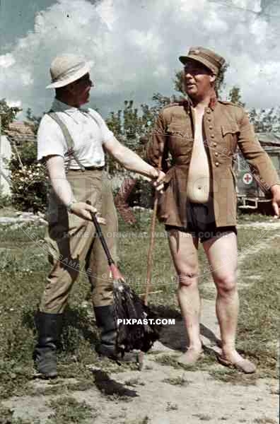 Afrika Korp officers joke around with captured Italian officer uniform, North Africa 1942