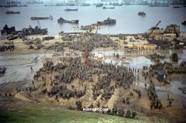 American infantry collecting on the beaches of Omaha Normandy D-Day plus 4 1944