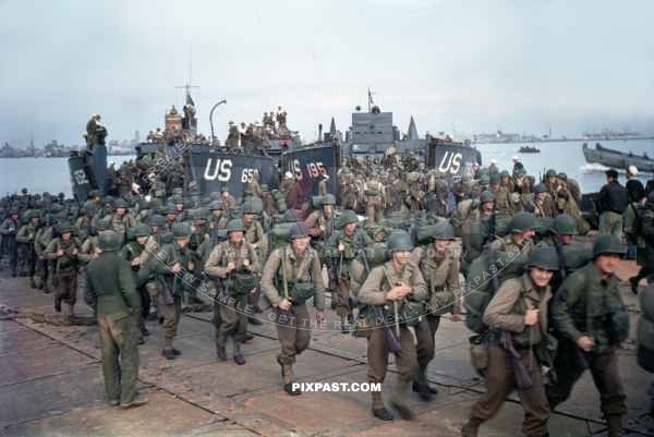 American infantry GIs unloaded from landing craft. Omaha Beach Normandy France. D-Day plus 4 1944