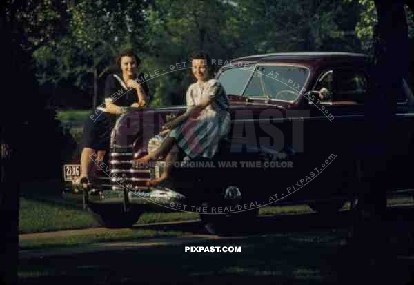Beautiful women sit on classic car with OHIO plates USA 1940 21-XG-OHIO-1940