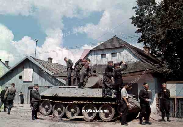 Captured Russian Soviet T34 tank in Dubno Lutsk Brody, Ukraine 1941. Inspected by German Luftwaffe ground troops.