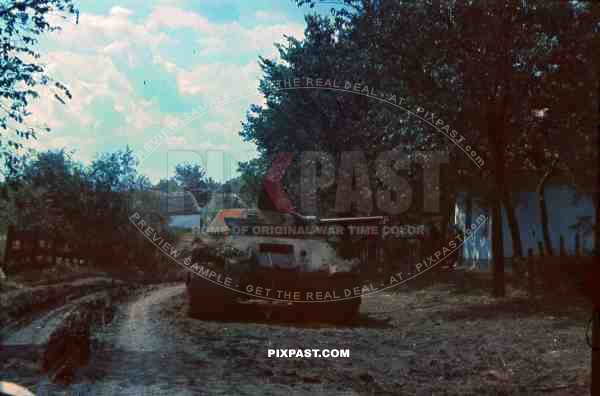 Captured Russian t34 panzer tank, Russian village, spring 1942, Tank burned out.