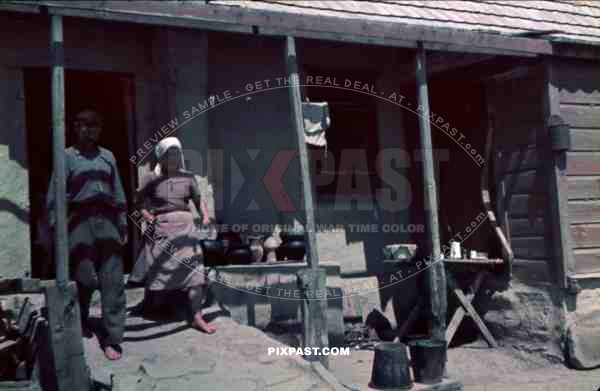 Color Photo of tyical peasent family house home tools axe Ukraine 1942