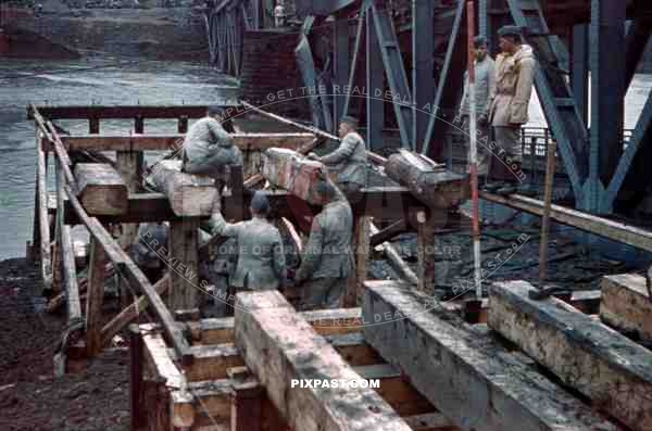 construction of a wooden bridge next to a broken rail bridge near Belgrade, Serbia ~1941