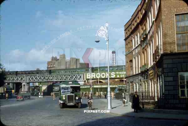 Corner of Store Street and Beresford Place, Dublin, Ireland, 1953, Green Bus, old cars, Dart Station, train