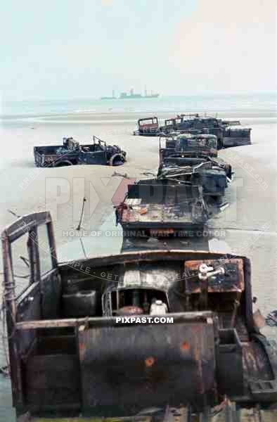 Destroyed British army trucks lying on the beaches of Dunkirk after the evacuation of the British Expeditionary Force May 1940