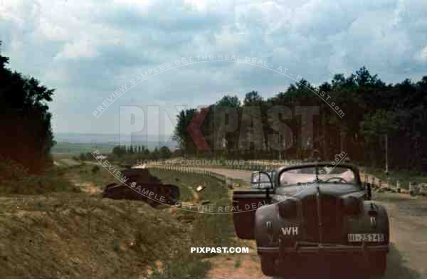 Destroyed Russian T26 Panzer Tank beside german Staff car, 94. Infantry Division, Swords, Signal corp, Summer 1941,