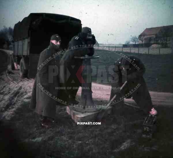 Dunkirk France winter 1940 Luftwaffe flak soldiers shovel aircraft viewer winter boots jacket