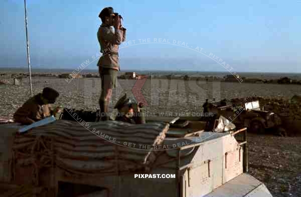 Field Marshal Erwin Rommel watching battlefield 1941 Tunisia in Captured British armoured truck MAX. MAMMUT