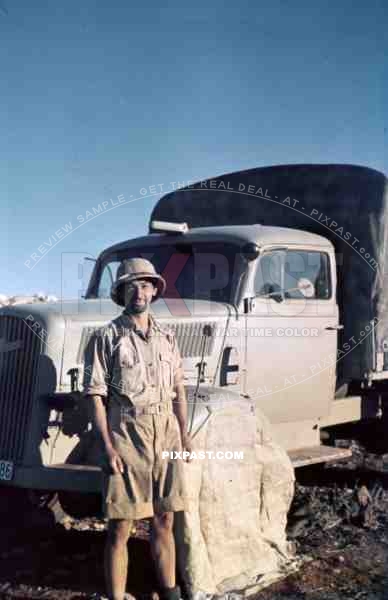 German Afrika Korp soldier in front of a supply truck, North Africa 1942