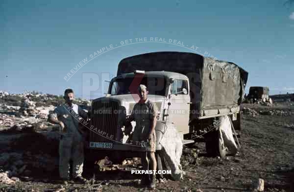 German Afrika Korp soldiers in front of a supply truck, North Africa 1942