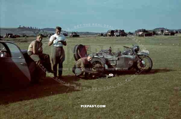 German BMW R12 MotorBike with sidecar, officers having lunch beside Panzer Park, 3rd Panzer Division. Beresina 1941.