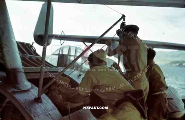 German Luftwaffe crew in tropical uniform load a Seaplane Dornier Do 24, Tripoli harbour in Libya, 1942.