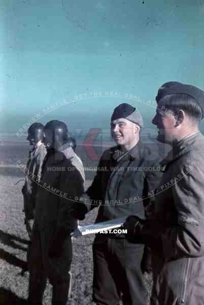 German Luftwaffe Glider Pilots with map, hats and uniform in Lubeck airport 1943