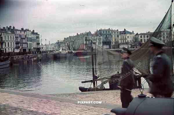 German officers with staff car inspect area in La Rochelle Harbour, France 1940. 4th Panzer Division.