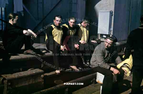 Kriegsmarine seamen sitting on the deck of a warship at the french Atlantic coast 1941