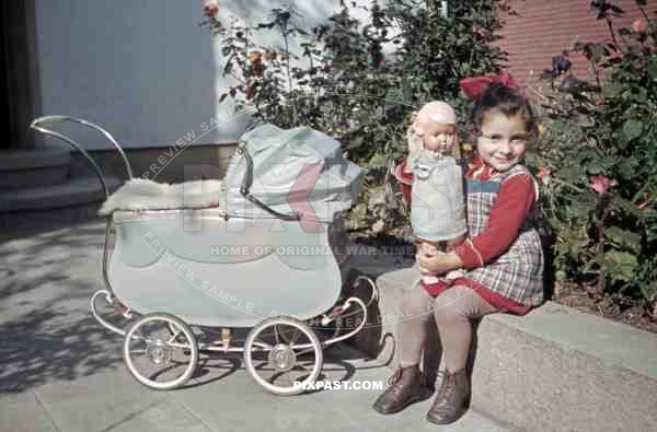 little girl with her doll and a pram in Germany 1938