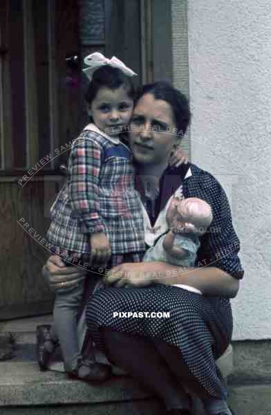 little girl with her mother and a doll in Germany 1938