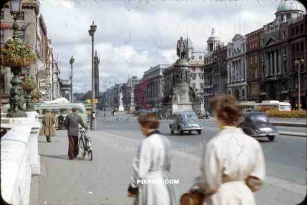 O_qt_Connell Street Dublin, Ireland, 1953, showing vintage cars and Nelson_qt_s pillar and Daniel O_qt_Connell Statue