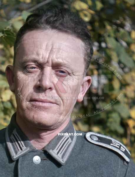 Very tired looking german army recruitment officer in the district of Munich city. Germany 1943