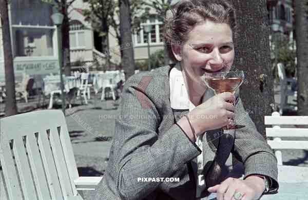 woman having a drink in TravemÃ¼nde, Germany 1940