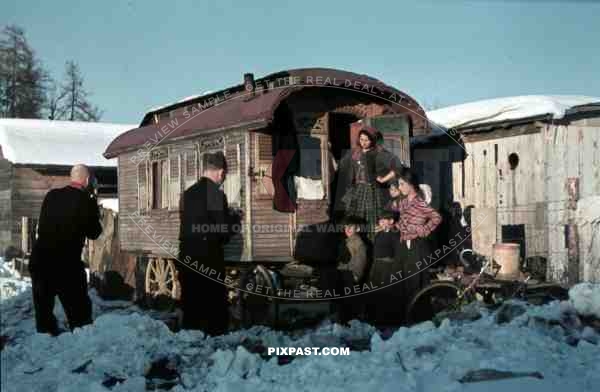 ww2 color 1939 Stuttgart German amateur photographers taking photos of Gypsy family in caravan horse wagon.