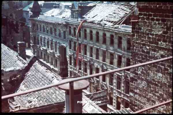 WW2 color Austria Vienna Wien Russian attack bombed 1945 rooftop citiy destroyed rubble ruins red flag