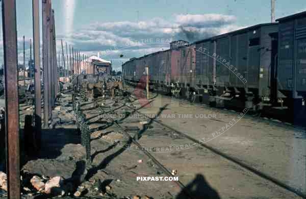 WW2 color Belgium 1945 Bombed German supply Train Station wagons 88mm ammo exploded