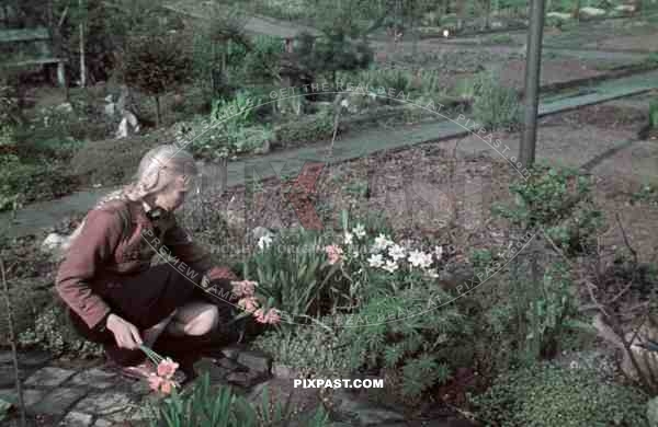 WW2 Color German Hitler Youth BDM girl in uniform flowers Bremerhaven apartment building garden
