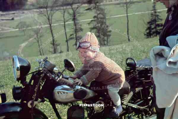 Young little child playing on a pre war NSU motorbike in Garmisch Partenkirchen Germany 1938