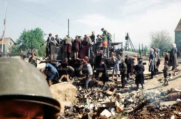 German civilian children scavenging for food in American army dump. Frankfurt am Main Germany 1945