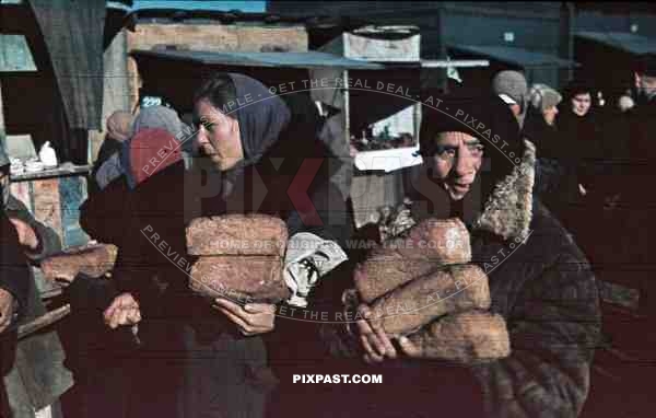 peasant women with loafs at the market, Romania 1942